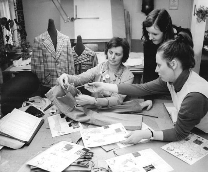 Designers working together on sketches for new kids' clothing.