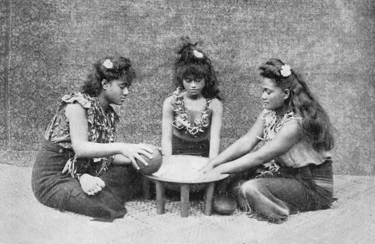 Old photo of three Samoan girls making a traditional drink.