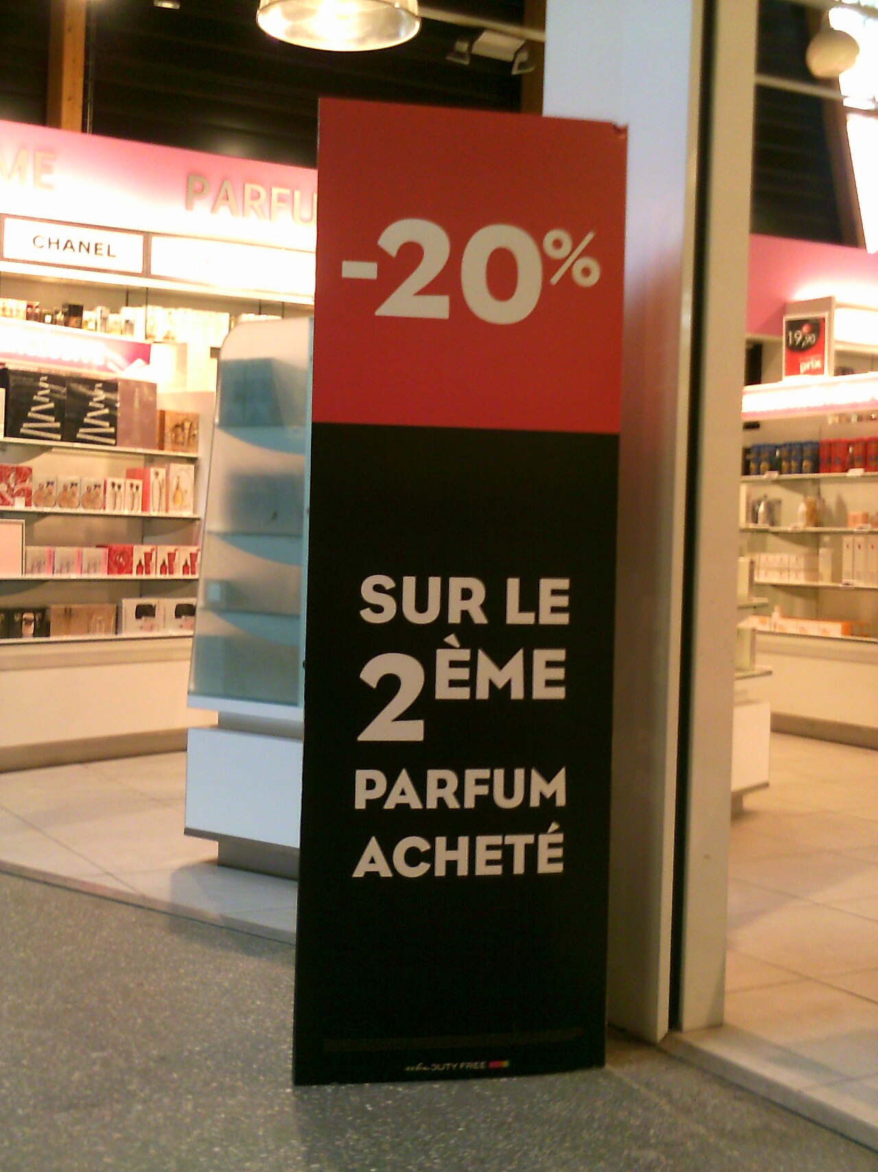 A shop sign shows a big percent off during a sale.