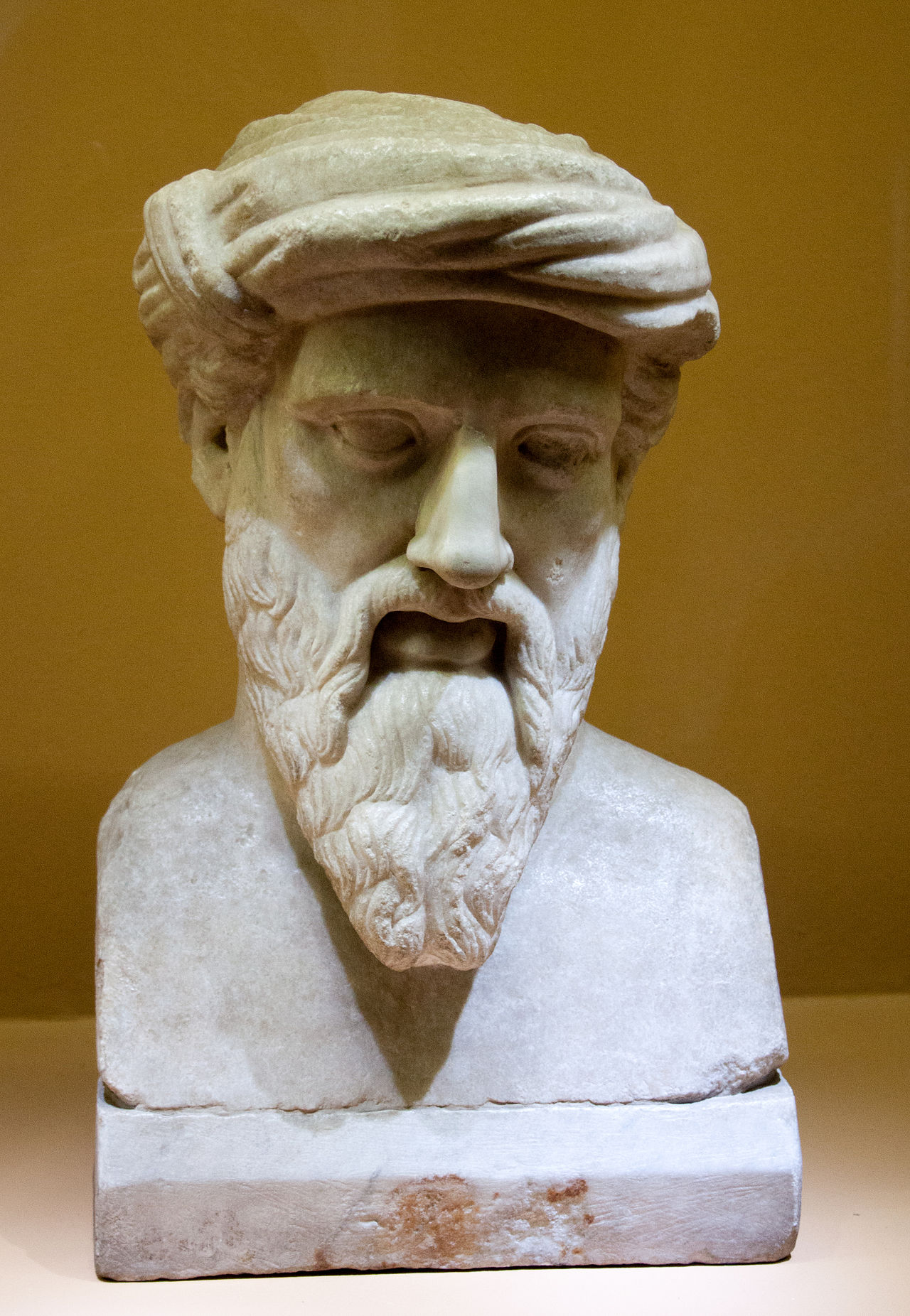 An old stone statue showing the Greek thinker Pythagoras.